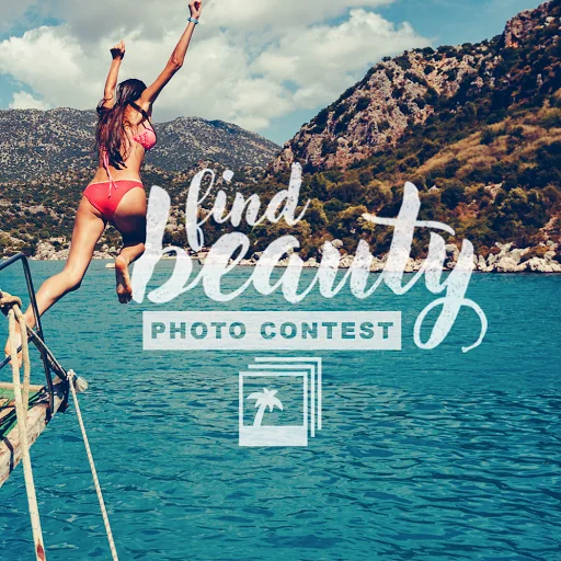 Photo contest asset showing a woman leaping from a boat into turquoise water beside a rocky coastline.