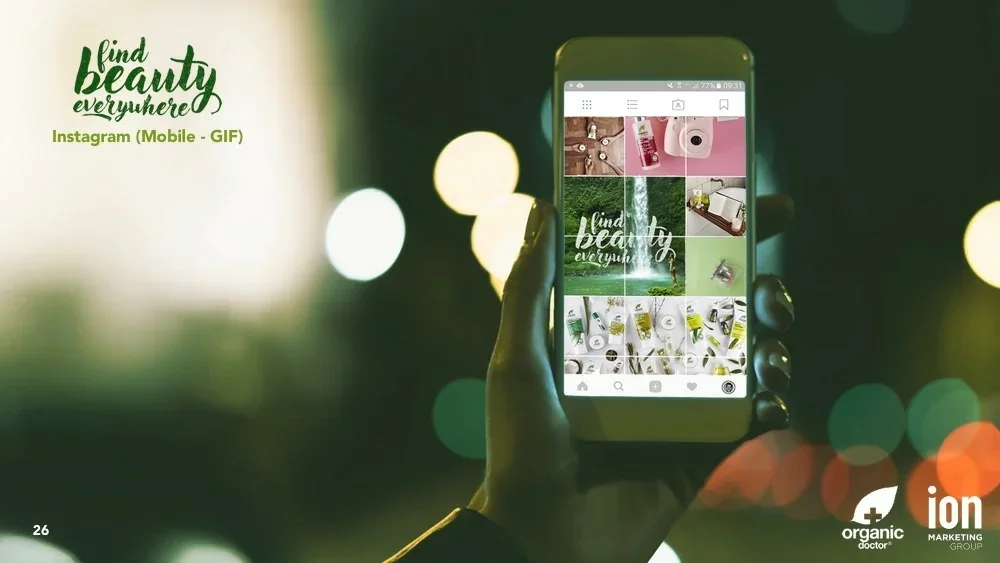Presentation slide showing a hand holding a phone displaying the Organic Doctor Instagram grid against a bokeh night background.