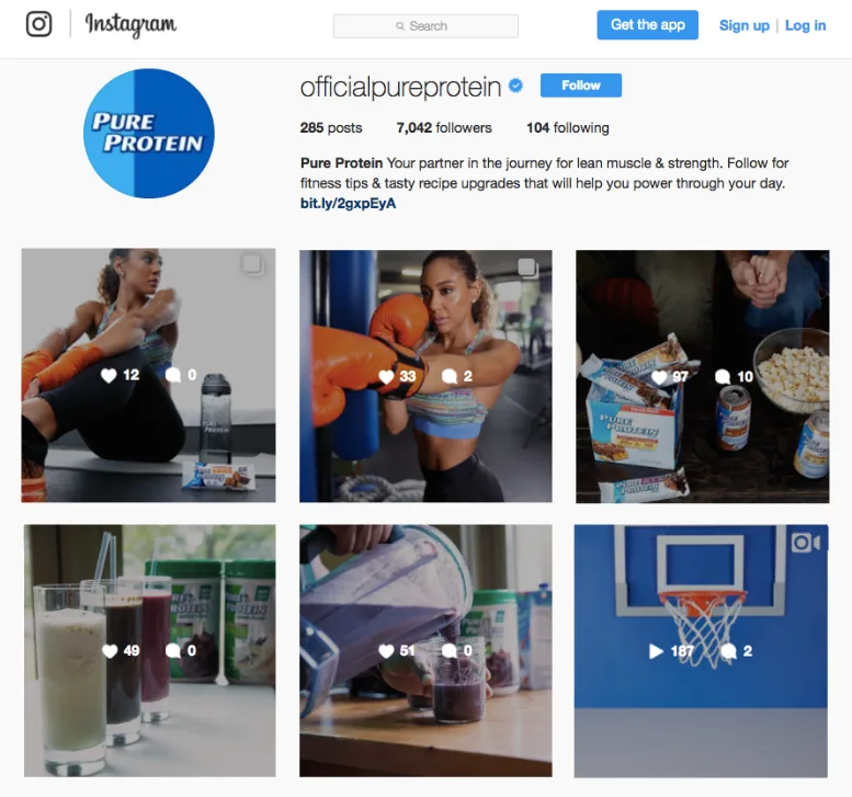 The official Pure Protein Instagram profile showing a grid of six posts including gym lifestyle, product flat lays and a basketball video.